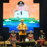 Bupati Sigi, Moh Rizal Intjenae menyampaikan laporan pada pembukaan Festival Danau Lindu 2025 di Venue Utama Festival Danau Lindu, Desa Tomado, Lindu, Sigi, Jumat (18/7/2025). (bmzIMAGES/basri marzuki)